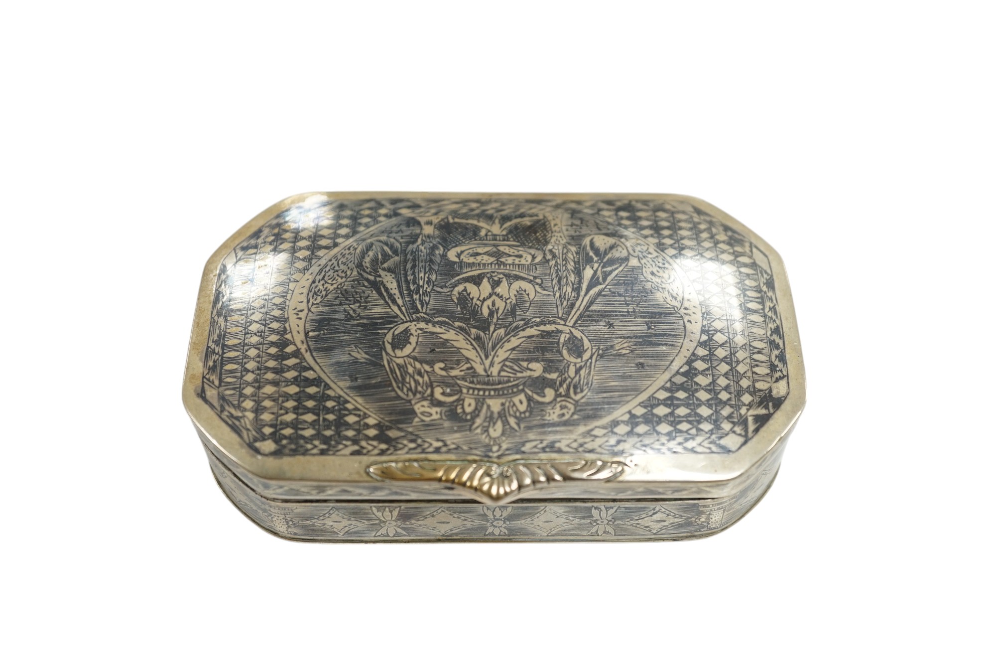 A continental white metal and niello octagonal box, 10.9cm. Condition - poor to fair